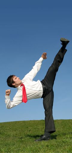 Business man flexible karate pose